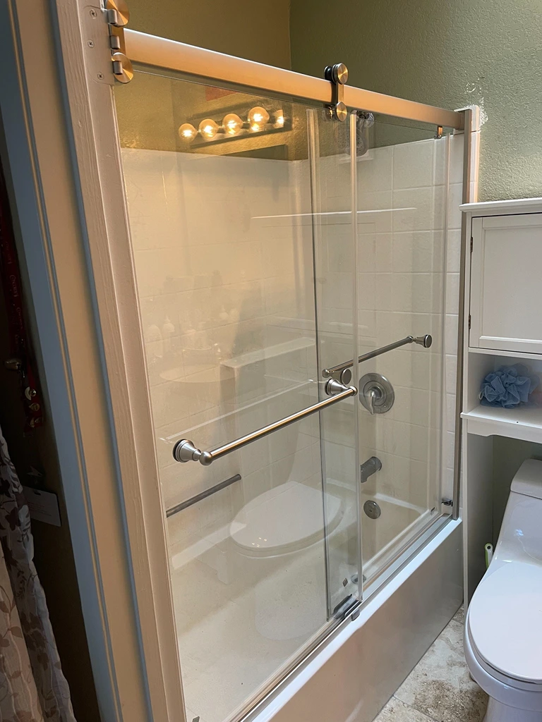 Framed Sliding Glass Shower Door Installation by Handy Ivan in San Diego, CA.