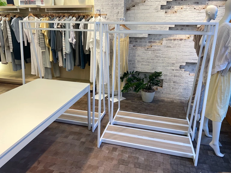 Commercial White Retail Clothing Rack Installation by Handy Ivan in San Diego, CA.